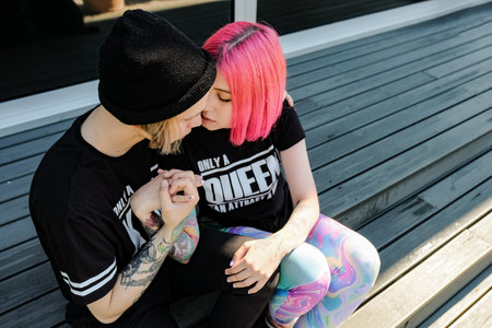 Couple in love. Beautiful young couple posing outdoor. Pink hair girl and hipster style