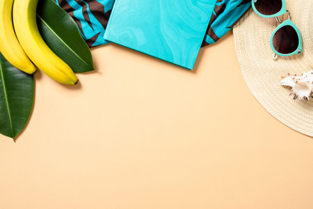 Top frame border of summer woman accessories and fruits on yellow background with free space for...