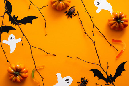 Happy halloween holiday concept. Halloween decorations, pumpkins, bats, candy, ghosts, bugs on...
