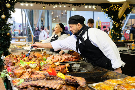 Budapest, Hungary. December 17, 2019: Vendors sells traditional Hungarian street food at one of the stalls in the advent Christmas market near St. Stephen's basilicaのeditorial素材