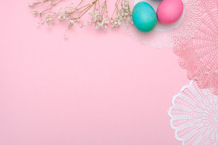 Easter eggs and napkins on pastel pink background. Top view, flat lay, Easter holiday concept,...