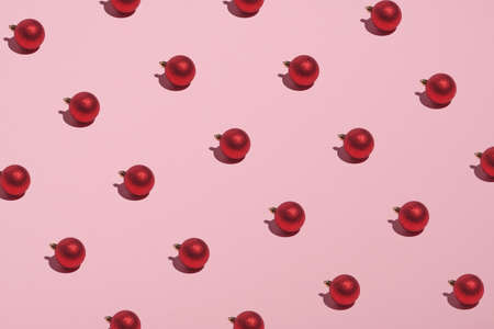 Christmas balls decoration pattern on pink background. Christmas, New Year, winter holidays concept.の写真素材