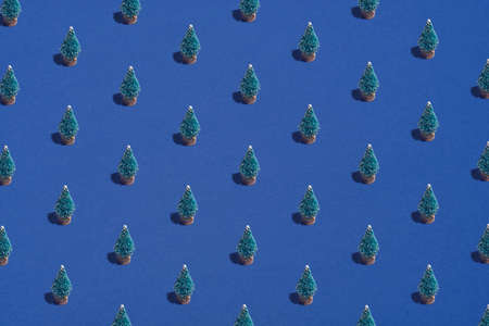 Pattern background of Christmas trees on blue. Christmas, winter holidays, New Year concept.の写真素材