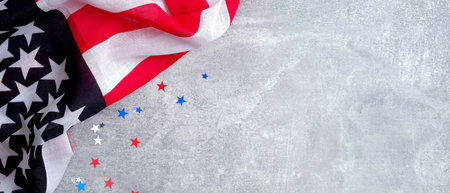 USA American flag and confetti stars on concrete stone background with copy space. Banner template...