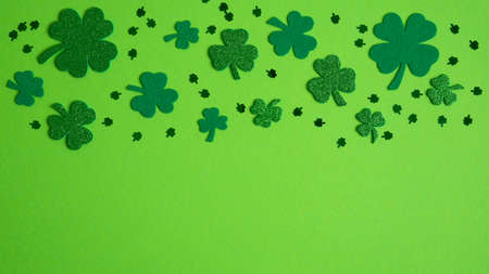 St Patricks Day banner design with shamrock and four-leaf clover. Flat lay, top view. Happy St. Patrick's day conceptの写真素材