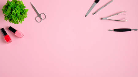 Manicure and pedicure tools on table in nail salon, view from above. Nail studio banner design template. Beauty treatment conceptの写真素材