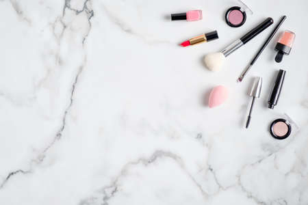 Makeup cosmetics and professional beauty products on marble background. Flat lay, view from above. Beauty salon banner design templateの写真素材