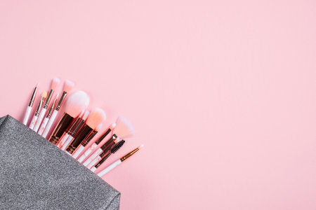 makeup brushes on pink background. Flat lay, top view.の写真素材