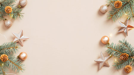 Christmas frame. Xmas tree branches decorated golden stars and balls on beige background. Flat lay,...