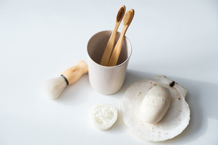 Set of eco friendly natural bathroom accessories on white background. Top view biodegradable bamboo...