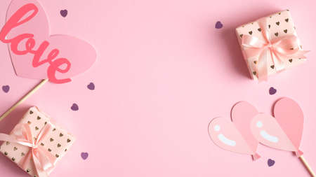 Happy Valentine's Day banner template. Frame of elegant Valentines Day decorations, hearts and gifts. Flat lay, top view. Creative design for party invitation, greeting card. Love and romance concept.の写真素材