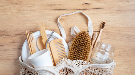 Zero waste concept. Cotton String Shopping Bag with Eco-Friendly kitchenware and bathroom items. Top...