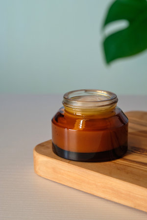 Amber glass jar of natural organic face cream. Moisturizer, skin care product concept.の写真素材