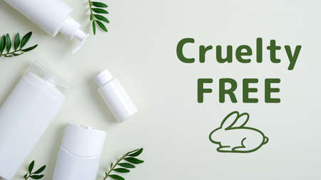 Cruelty free cosmetics on green background with leaves. No animal testing. Natural organic SPA beauty products set.の写真素材