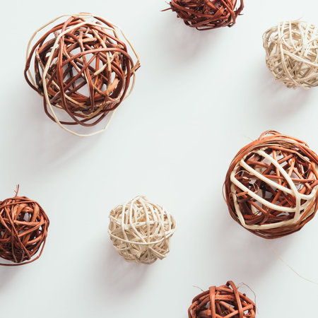 Abstract autumn background with wicker tumbleweed decorations. Flat lay, top view.