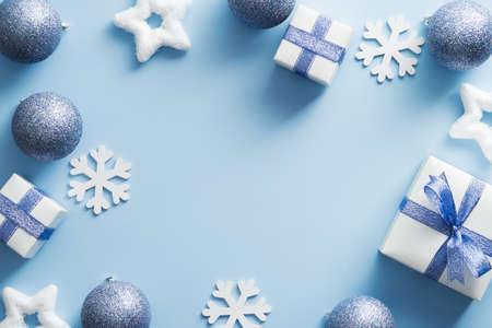 Blue Christmas background with decorations, baubles, snowflakes, gifts. Christmas holiday celebration, winter, New Year concept. Christmas banner mockup, greeting card templateの写真素材