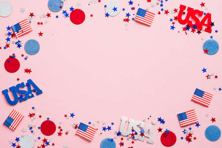 Happy Labor Day banner mockup. Frame made of USA flag color confetti and decorations on pink background. US Independence Day, Memorial Day, US Veterans day concept.の写真素材