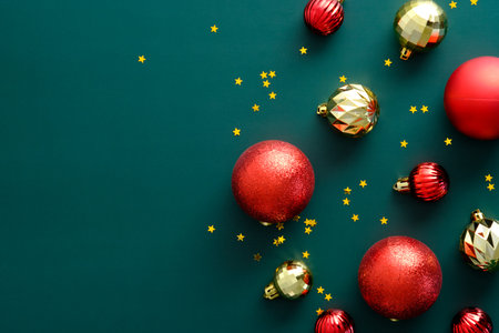 Vintage Christmas composition with red and golden balls on green background. Flat lay, top view, overhead. Merry Christmas banner design, Happy New year greeting card mockupの写真素材