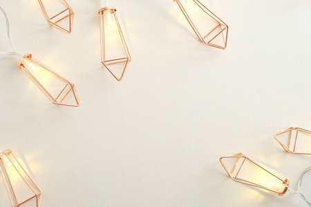 Modern Christmas Light Garland on white background. Flat lay, top view, copy space.