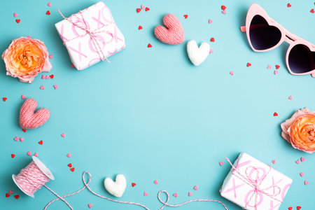 Happy Valentines Day concept. Frame made of gifts, heart-shaped sunglasses, hearts, confetti on...