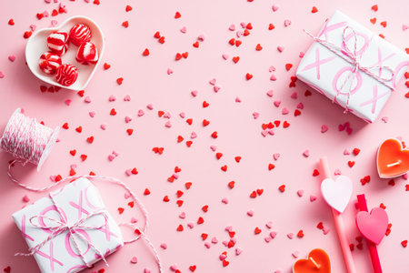 Happy Valentines Day concept. Flat lay composition with gift boxes, confetti, festive decorations on...