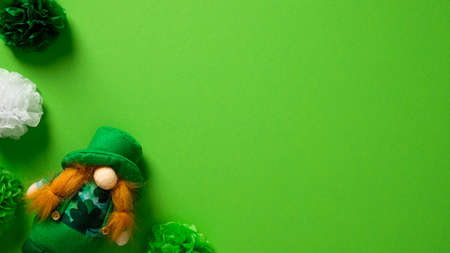 St Patricks day banner design. Leprechaun and holiday decorations on green background. Flat lay, top view, copy space.の写真素材