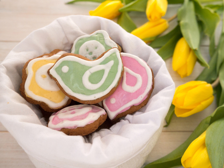 Bird and flower shaped cookies in the white linen bagの写真素材