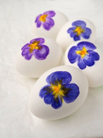 Five Easter eggs with viola paintingの写真素材