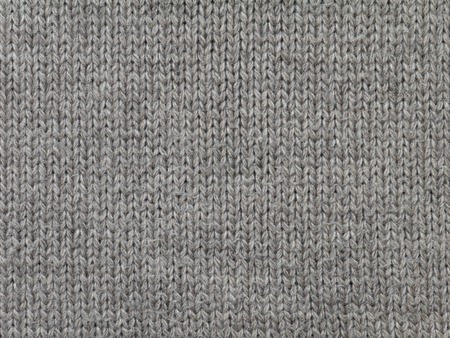 Dark brown knitted wool fabric cool weather backgroundの写真素材