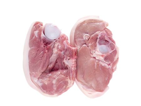 Sucking pig cutlet slices isolated on whiteの写真素材