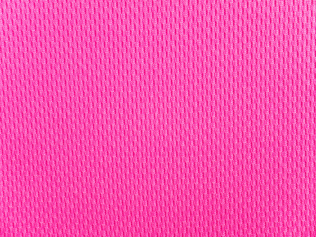 Bright pink polyester sportwear knitted fabric textureの写真素材