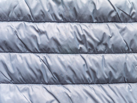 Silver gray horizontal striped quilted winter cloth background