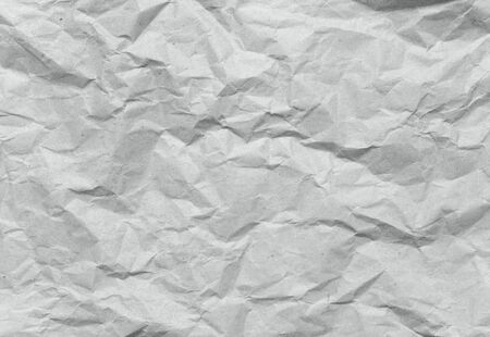 Crumpled gray recycled rough packing paper texture backgroundの写真素材