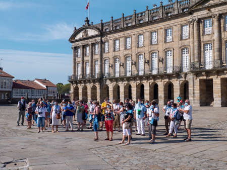 SANTIAGO DE COMPOSTELA, SPAIN - September 13, 2020: Tourists make photo of the Cathedral on the Obradoiro square in the Santiago de Compostela city during pandemia of covid-2019, Santiago de Compostela,Galicia, Spain.のeditorial素材
