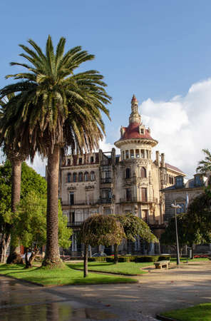 RIBADEO, SPAIN - October 4, 2020:Torre de los Moreno building and palm trees at the Plaza de Espana square in the Ribadeo city center, Lugo, Galicia, Spain.のeditorial素材