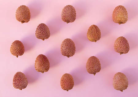 Lychee fruits pattern on the pink background. Litchi chinensisの写真素材