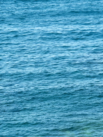 Vertical dark blue sea ripples background. Sea surface wrinkled with the wind. Water backdrop. Aquatic texture.
Aesthetic mobile phone wallpaper.の写真素材