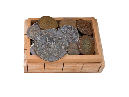 Treasure of ancient coins in a wooden chest isolated on white. Old metallic money of different countries in the box.
Piggy bank of coins out of circulation. Ancient hoard.の写真素材