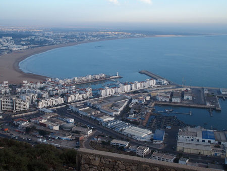 AGADIR travel city landscape in MOROCCO with white buildings on cityscape and beach at Atlantic Ocean at evening in 2016 winter day - aerial view, Africa on February.の写真素材