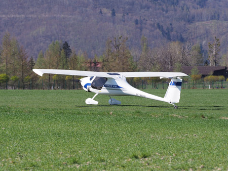 BIELSKO-BIALA, POLAND on APRIL 2018: White Pipistrel Virus SW airplane on grassy airfield closeup,...