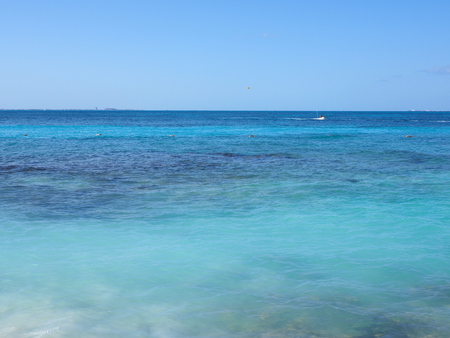 Beauty seascape panorama of turquoise waters of Caribbean Sea landscapes at Cancun city at Quintana Roo in Mexico with horizon line, clear blue sky in 2018 hot sunny winter day, North America on Marchの写真素材