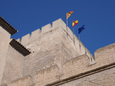 Tower with flags in European city, Aragon district in Spain, clear blue sky in 2019 warm sunny summer day, Septemberの写真素材