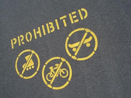no cycling and skating sign stencilled on a pavementの写真素材