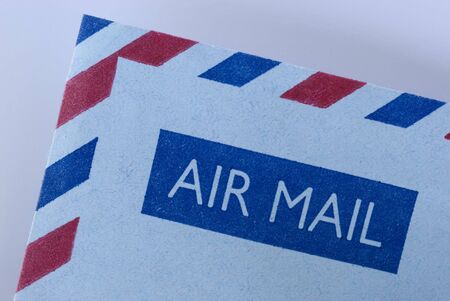 airmail envelope with it's distinctive blue and red striped boarderの写真素材