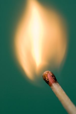 flames bursting from a matchhead just after lightingの写真素材
