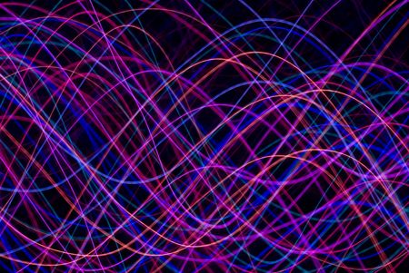 abstract background of colourful sinusoidal waveforms in red pink magenta and blueの写真素材