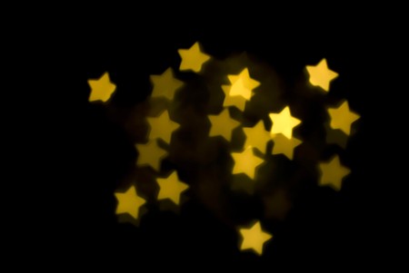 a background image of yellow gold bokeh starsの写真素材