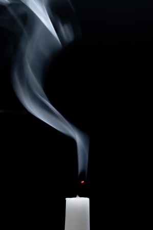 Smoking white candleの写真素材