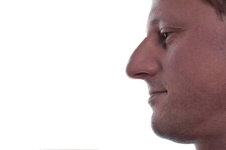 A unshaved man is looking pleasedの写真素材