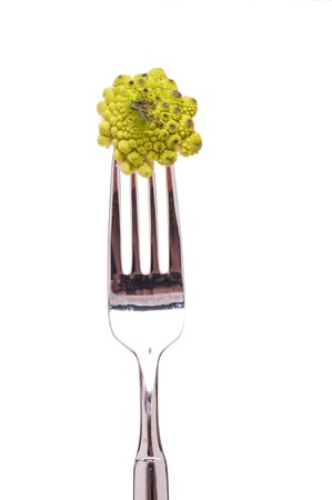 White isolated fork with romanesco cauliflowerの写真素材